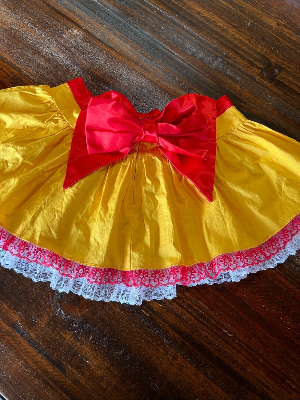 Yellow Skirt with Red Bow and Lace Trim
